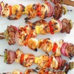 overhead view of six shish kabobs