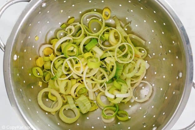sliced leeks in a colander