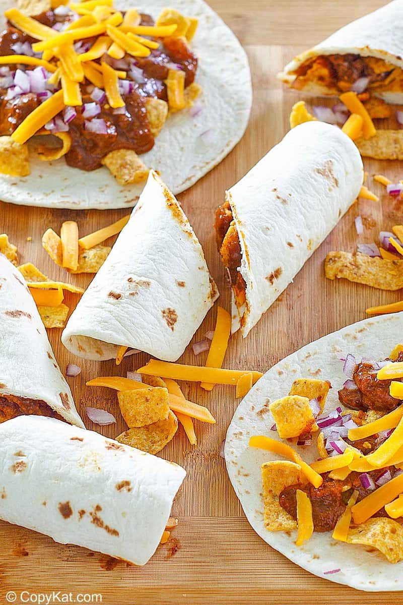 homemade Sonic Frito chili cheese wraps on a wood board