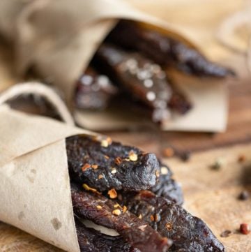 homemade spicy beef jerky wrapped in brown parchment paper