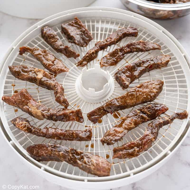 spicy beef jerky in a dehydrator
