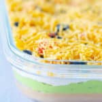 side view of 7 layer dip in a glass serving dish