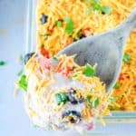 7 layer dip on a serving spoon