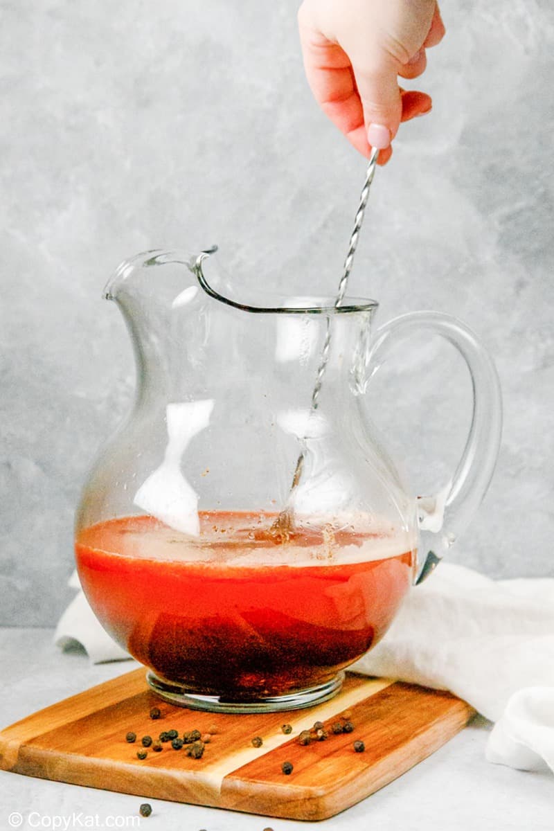 stirring homemade bloody mary mix