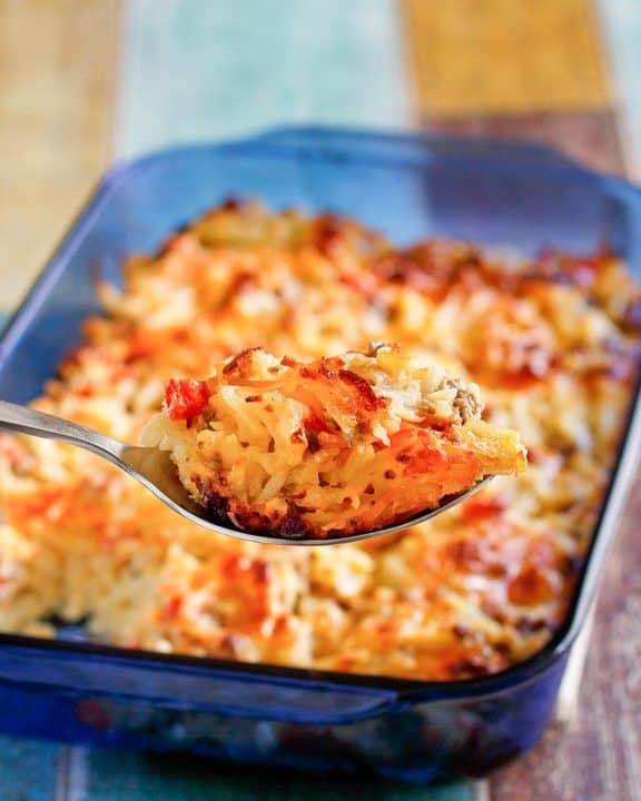 homemade Cracker Barrel loaded hash brown casserole on a spoon