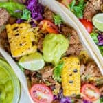 overhead view of a ground beef taco with colorful toppings