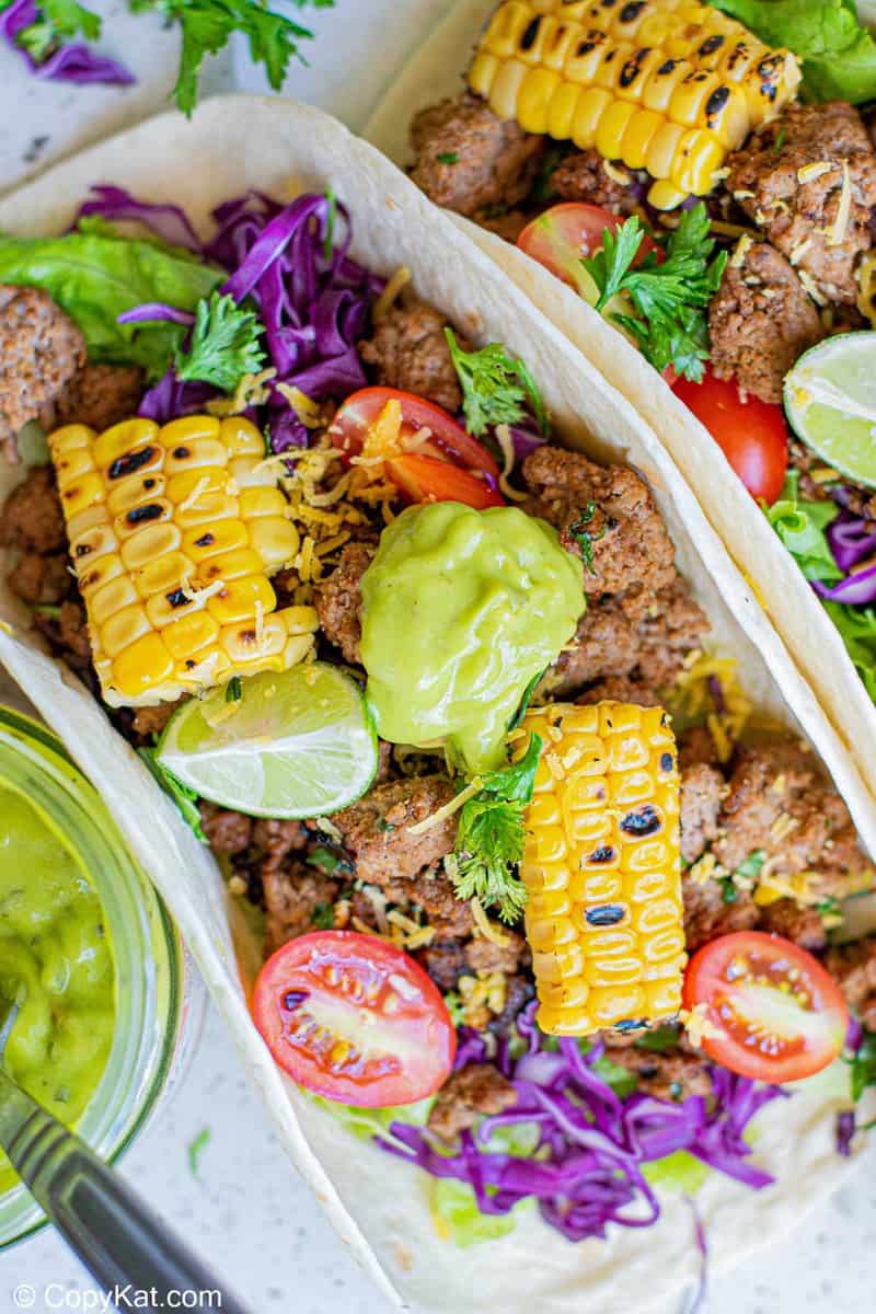 overhead view of a ground beef taco with colorful toppings