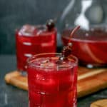 two glasses and a pitcher of ya ya punch