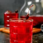 homemade Ya Ya Punch garnished with cherries