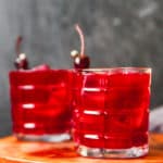 two glasses of homemade Joe's Crab Shack Ya Ya Punch with cherries