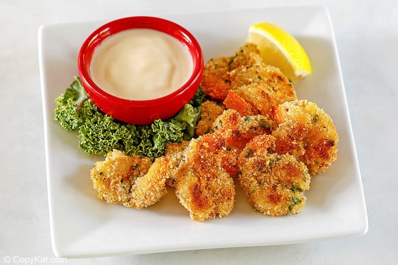 shrimp alexander and beurre blanc sauce on a plate
