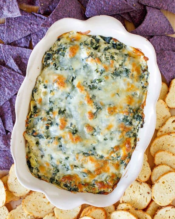homemade Olive Garden spinach artichoke dip, crostini, and tortilla chips
