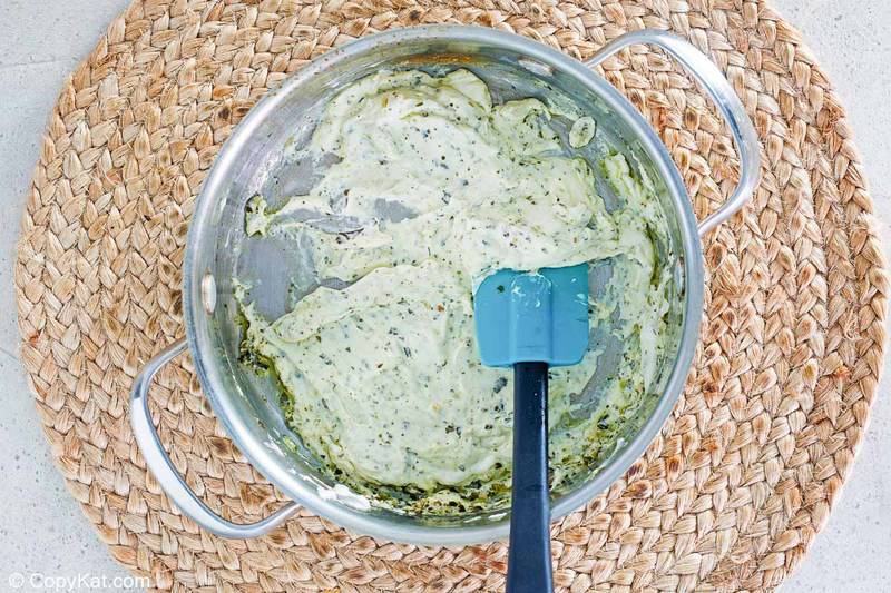 pesto cream cheese sauce in a pan
