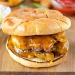 Homemade Steak and Shake garlic double cheeseburger on a wood cutting board.