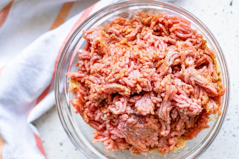 ground beef mixed with taco seasoning in a bowl