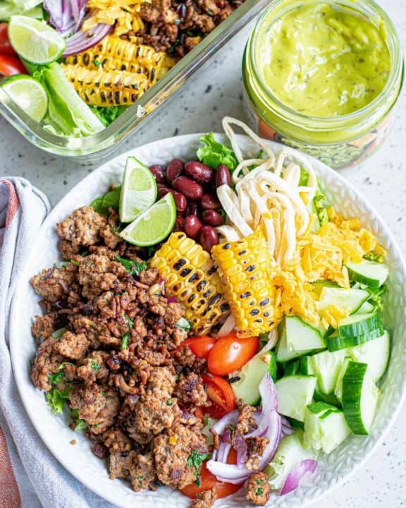 overhead view of a ground beef taco bowl and guacamole