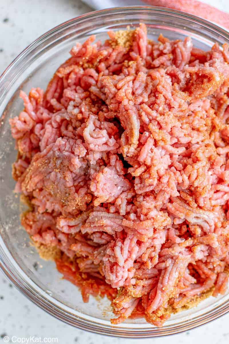 ground beef mixed with taco seasoning in a bowl