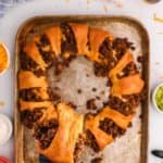 piece of a taco ring on a spatula held over the ring