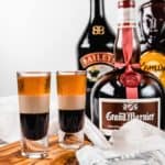 two B52 shots and bottles of Grand Marnier, Bailey's Irish Cream, and Kahlua