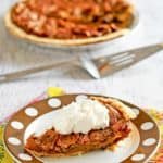 a slice of chocolate pecan pie on a plate