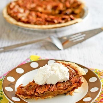 a slice of chocolate pecan pie on a plate