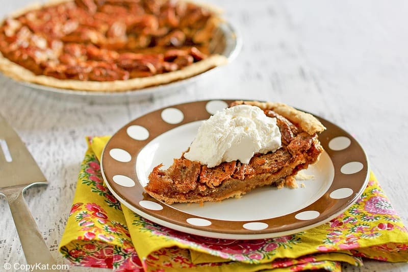 a slice of homemade Cracker Barrel chocolate pecan pie on a plate