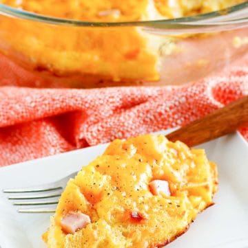 homemade Cracker Barrel ham and egg casserole on a plate and in a baking dish