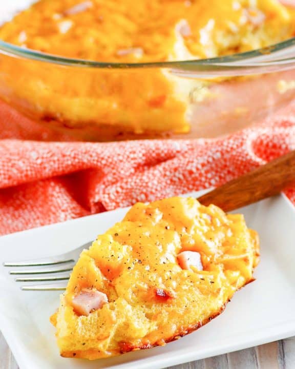 homemade Cracker Barrel ham and egg casserole on a plate and in a baking dish
