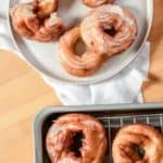 overhead view of French crullers on a plate and wire rack