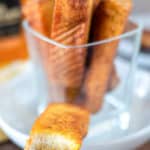 french toast sticks with a bite taken out of one