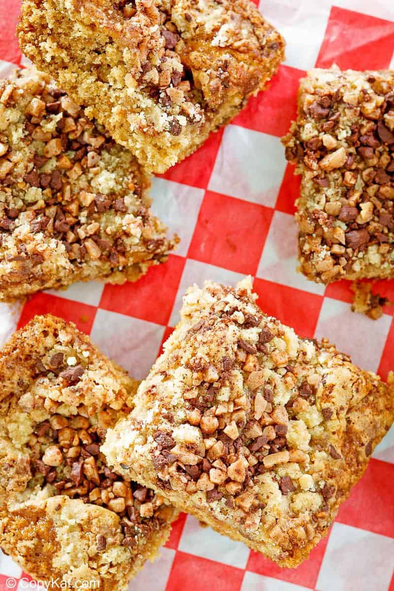overhead view of slices of Heath bar cake on parchment paper