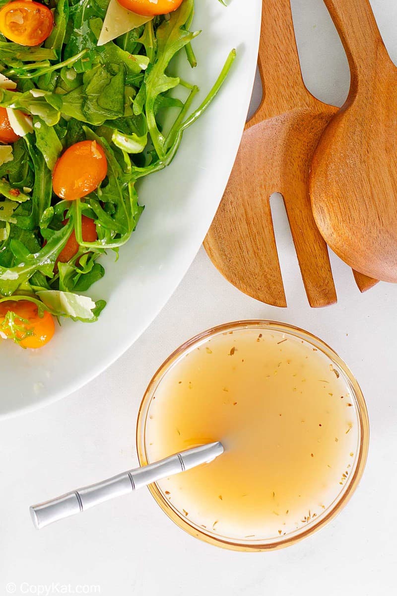 overhead view of homemade Italian salad dressing and a salad