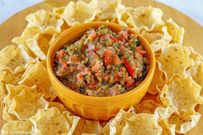 a bowl of homemade Pappasito's salsa and tortilla chips on a platter
