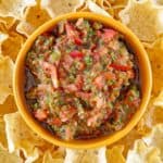 overhead view of homemade Pappasito's salsa in a bowl and tortilla chips