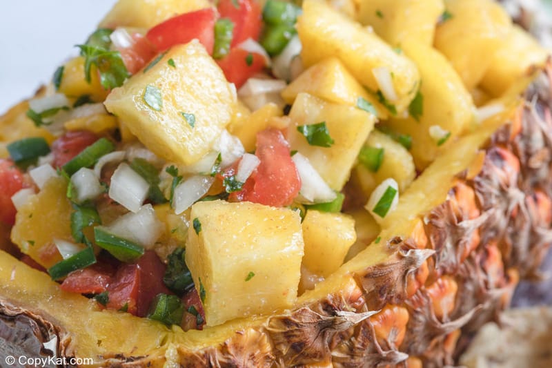 closeup of pineapple mango salsa in a pineapple