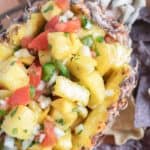 pineapple mango salsa in a fresh pineapple