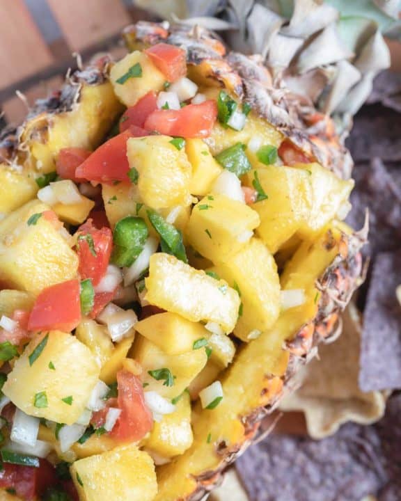 pineapple mango salsa in a fresh pineapple