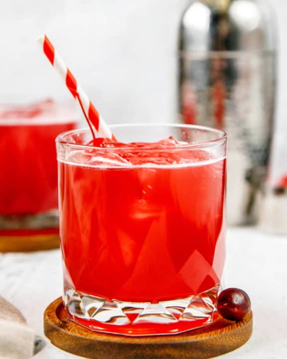 Ruby Relaxer cocktail and a fresh cranberry