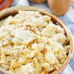 homemade roasted garlic mashed potatoes in a serving dish