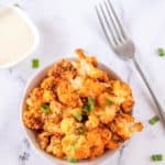 overhead view of a bowl of air fryer buffalo cauliflower