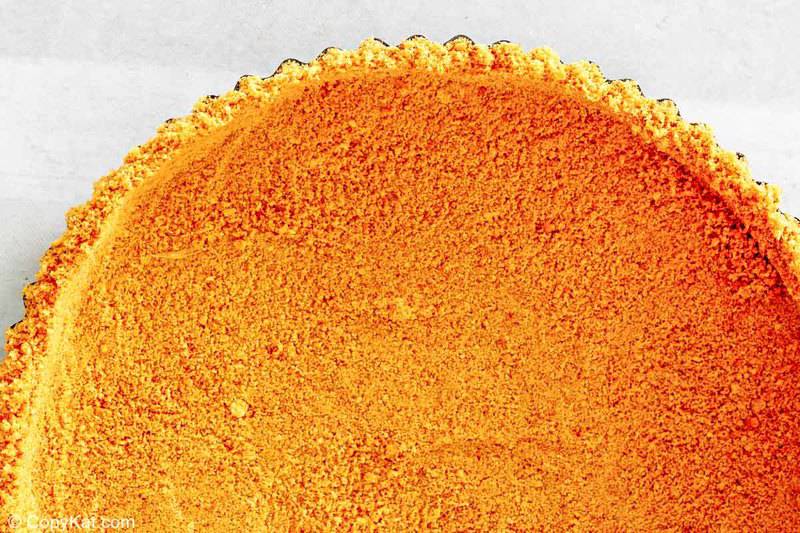 graham cracker pie crust in a fluted pan