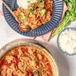overhead view of butter chicken in a pan and in a bowl with rice