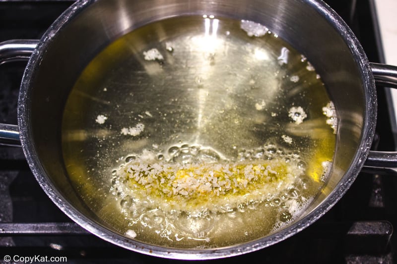 deep frying a breaded pickle spear