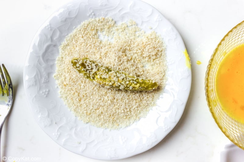 pickle breaded with flour, egg, panko, and parmesan