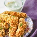 homemade Disney fried pickle spears, ranch dressing, and a napkin