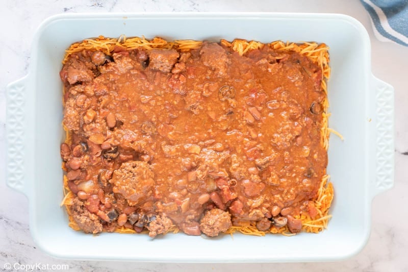 first meat and bean layer in Dorito casserole