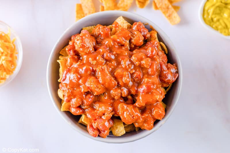 a bowl of Fritos topped with chili