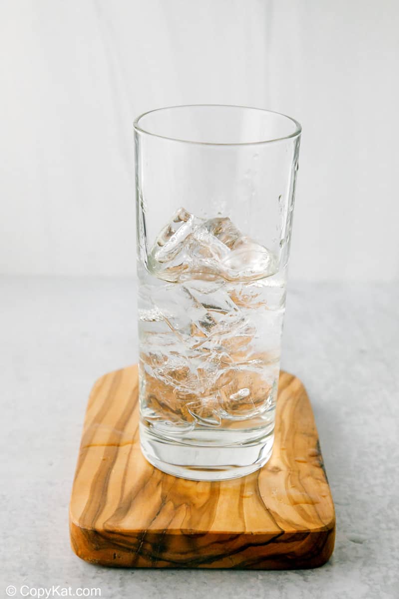 ice and peach schnapps in a glass