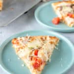 a slice of homemade Olive Garden chicken formaggio pizza on a plate