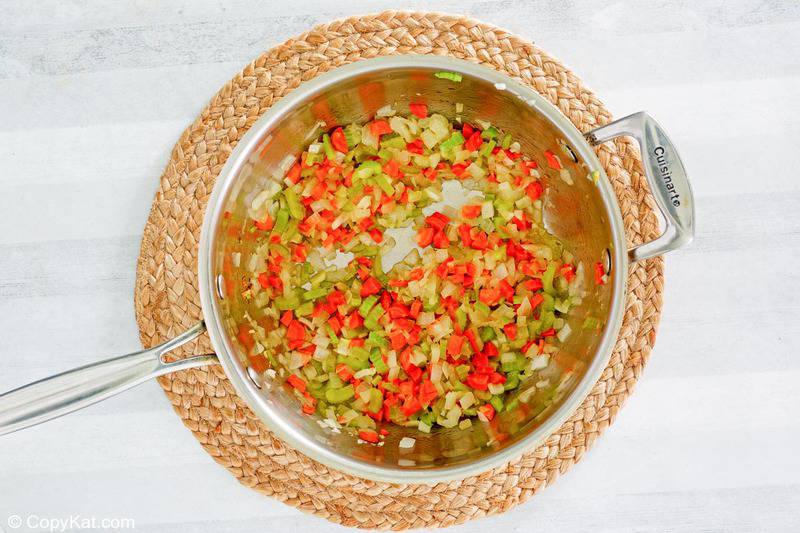 chopped onions, celery, and carrots in a pot